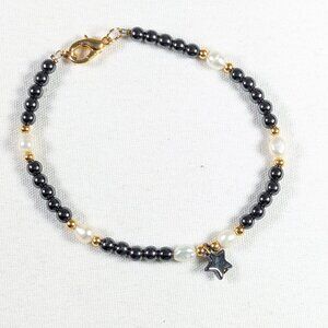 Hematite and pearl gold plated bracelet